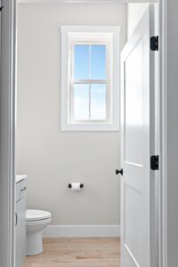 A bathroom at 68 Eden Lane featuring a window and a toilet.