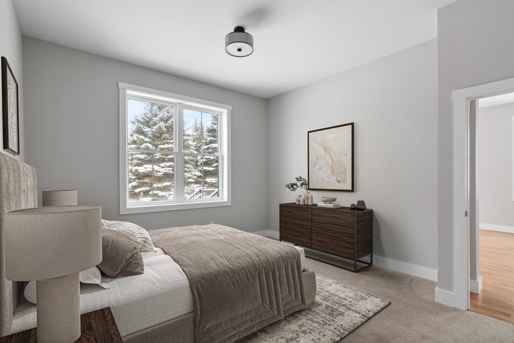 A Castlerock Paired Villa bedroom with a cozy bed and stylish dresser.