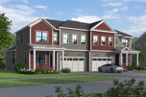 Modern two-story paired villa in The Annex with red and gray siding, large windows, two garages, and a car parked outside.